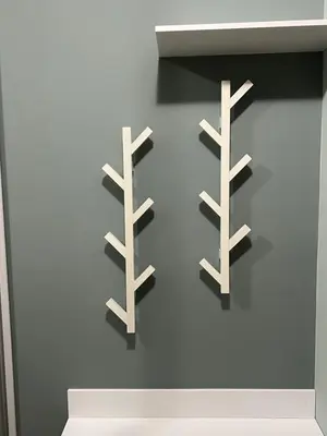 a wall with three wooden shelves on a wall at Borovets Gardens Apartment B15 in Borovets
