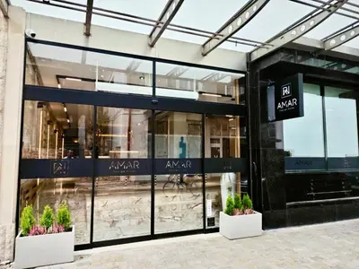 a store front of a building with plants at AMAR Design Hotel by HMG in Sofia