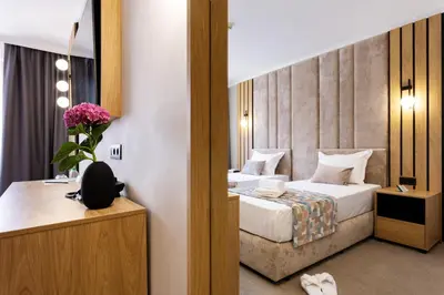 a hotel room with a bed and a mirror at AMAR Design Hotel by HMG in Sofia