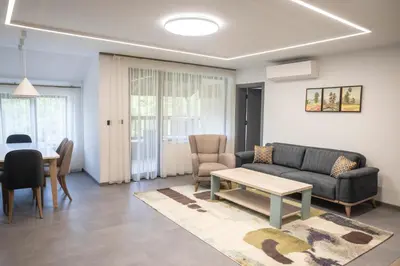 a living room with a couch and a table at Arni Aparts in Velingrad