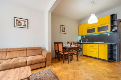 a living room with a couch and a table at Pirotska 2-Bedroom 100m2 Apartment in Sofia Center in Sofia