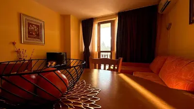 a living room with a basketball on a table at Апартаменти Хармония in Pamporovo