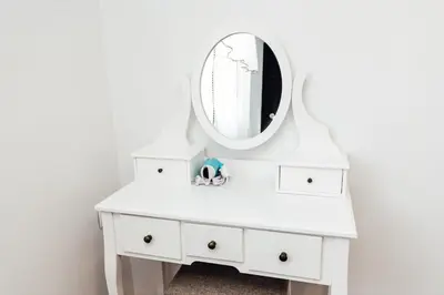 a white dressing table with a mirror on it at Къщи БРИК вила 2 in Sapareva Banya