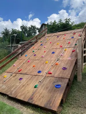 a large wooden board with climbing equipment on it at Spa Villas Daffi in Smolyan