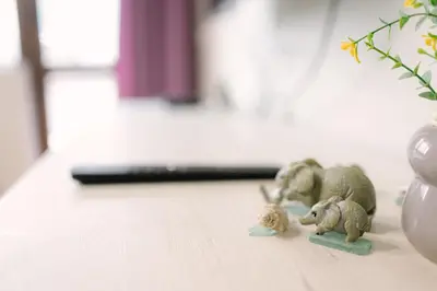 two figurines of elephants on a floor next to a vase at Top Center Retreat, Near AUBG FREE Parking in Blagoevgrad