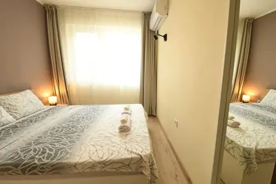 a bedroom with two beds and a window at INB Banishora Spot in Sofia