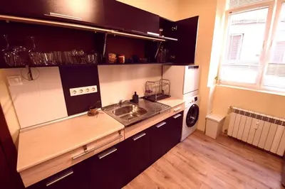 a kitchen with a sink and a dishwasher at Eagle's Spot in Sofia