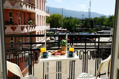 a table with a plate of food on a balcony at Eagle's Spot in Sofia
