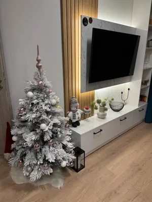 a christmas tree in a living room with a tv at Anna Lux in Bansko