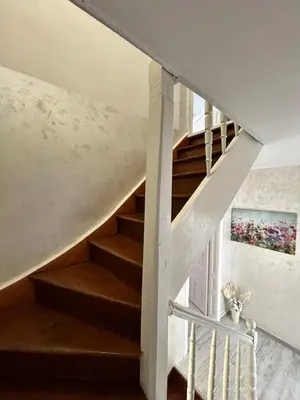 a staircase in a house with a white stair case at Smile House in Plovdiv