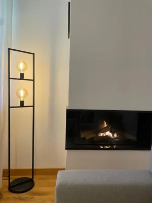 a living room with a fireplace and a couch at Borovets Boutique Apartment Sequoia II in Borovets