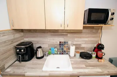 a kitchen counter with a sink and a microwave at Swan7 Studios in Plovdiv