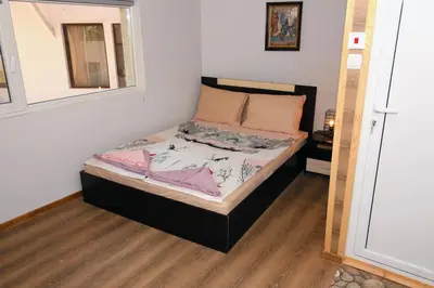 a small bedroom with a bed in a room at Swan7 Studios in Plovdiv
