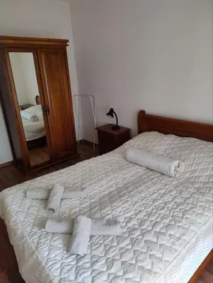 a bedroom with a bed with towels on it at Apartment near by Studenec-Cedar Heights 1 in Pamporovo