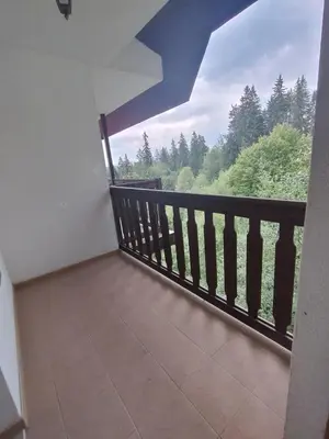 a balcony with a view of the forest at Apartment near by Studenec-Cedar Heights 1 in Pamporovo