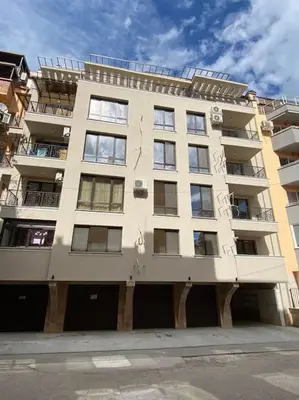 a tall white building with a lot of windows at Бутиково студио Joy-free parking in Plovdiv