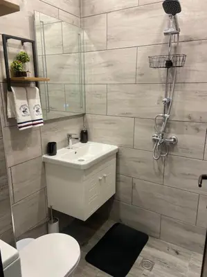 a bathroom with a sink and a toilet and a shower at Бутиково студио Joy-free parking in Plovdiv