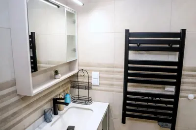 a bathroom with a sink and a mirror and a shelf at Sophie Studio - Top center, Cozy & Work-Friendly near AUBG, Free streaming platforms in Blagoevgrad