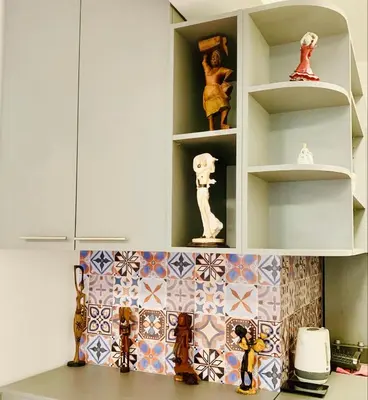a kitchen with white cabinets and colorful tiles at Little Paris with Free Garage Near Tokuda Hospital in Sofia