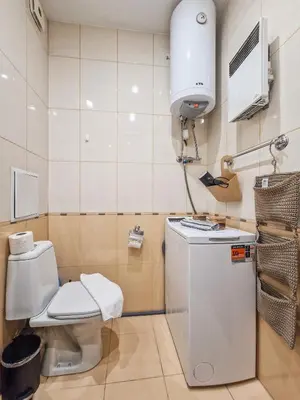 a small bathroom with a toilet and a sink at Cosy Apartment On The Lift in Bansko