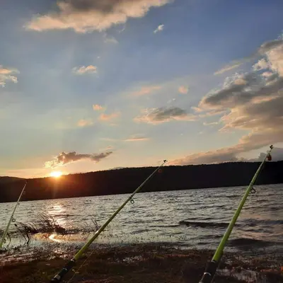 two poles in front of a body of water at Zodiac House in Samokov