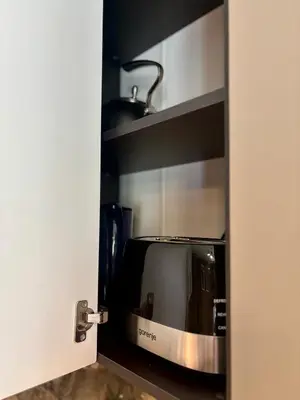 a microwave sitting inside of a kitchen door at Business Park Sofia Cozy Lux & Private Garage Option in Sofia