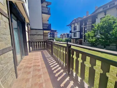 a balcony of a house with a wooden fence at Bansko Cozy Peak in Bansko