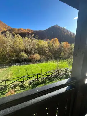 a view of a field from a train window at Къща за гости Лъките in Divchovoto