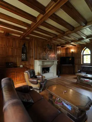 a living room with a couch and a table at The Castle - Your unique way of retreat in Borovets