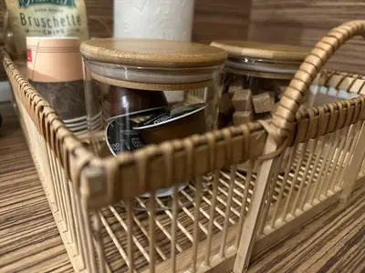 a wicker basket with two stools in it at Cozy studio in Green Life Bansko in Bansko