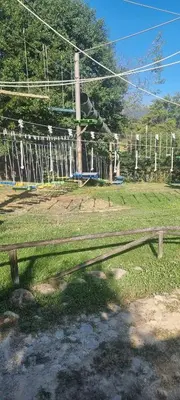 a park with a roller coaster in a field at Cozy studio in Green Life Bansko in Bansko