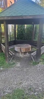 a picnic shelter with a bench in a park at Cozy studio in Green Life Bansko in Bansko