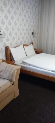a bedroom with two beds with white pillows at Guest house Elora in Chiflik