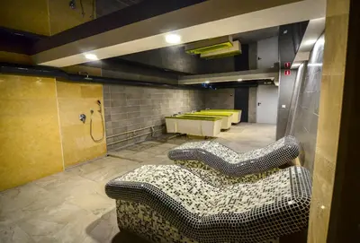 a room with three couches and a room with yellow beds at Hit Hot House in Sandanski