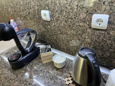 a kitchen counter with a tea pot and a tea kettle at Ideal Center by the Park - Walk to Kapana in Plovdiv