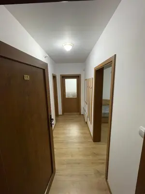 a hallway leading to a room with a door at PAMPOROVO Raikovski lodge in Pamporovo
