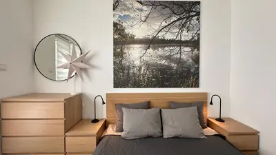 a bedroom with a mirror and a bed at Chill Out Urban Studio in Plovdiv