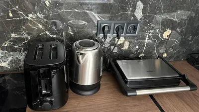 a coffee maker and toaster sitting on a counter at Chill Out Urban Studio in Plovdiv