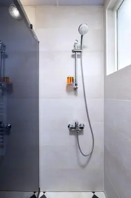 a shower in a bathroom with a glass door at Central Family Apt Fuzzy Muzzy 2 bedrooms MU University in Plovdiv