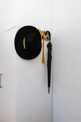 a hat and an umbrella hanging on a wall at Hidden Gem in the Heart of Plovdiv in Plovdiv