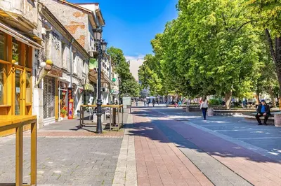 a city street with people walking down the street at Hidden Gem in the Heart of Plovdiv in Plovdiv