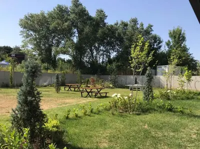 a park with a picnic table in the grass at Palermo Family designer Apt near UNSS w Fast WiFi in Sofia