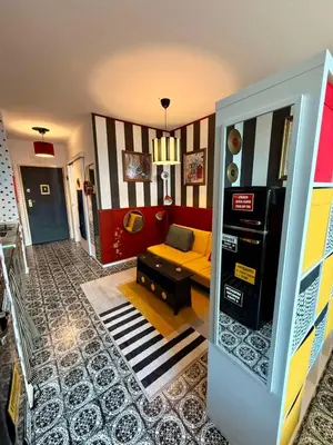 a living room with a yellow couch in a room at Palermo Family designer Apt near UNSS w Fast WiFi in Sofia