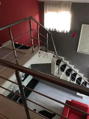 a metal bunk bed with stairs in a room at Sequoia Loft apartment in Borovets