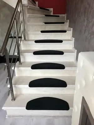 a set of stairs with black cushions on them at Sequoia Loft apartment in Borovets