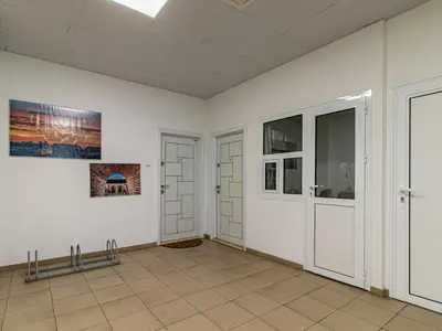 a room with white walls and two doors at Stay & Explore Sofia - Central Studio in Sofia