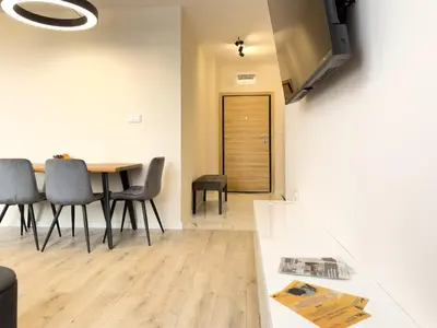 a dining room with a table and chairs at 2BR Business Suite with FREE GYM, by Holiwork Stays in Plovdiv