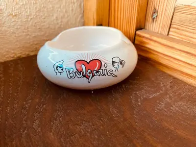 a bowl with a heart on it sitting on a table at Vita Stulba Guest House in Sandanski
