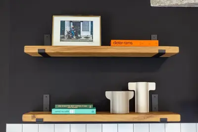 a wooden shelf with a picture and some books at Vintage Parkside whit Free Parking near Center in Plovdiv