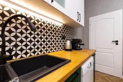 a kitchen with a sink and a black and white wall at The Urban Nest-2BD Apartment with a Terrace by Flat Mаnager in Plovdiv